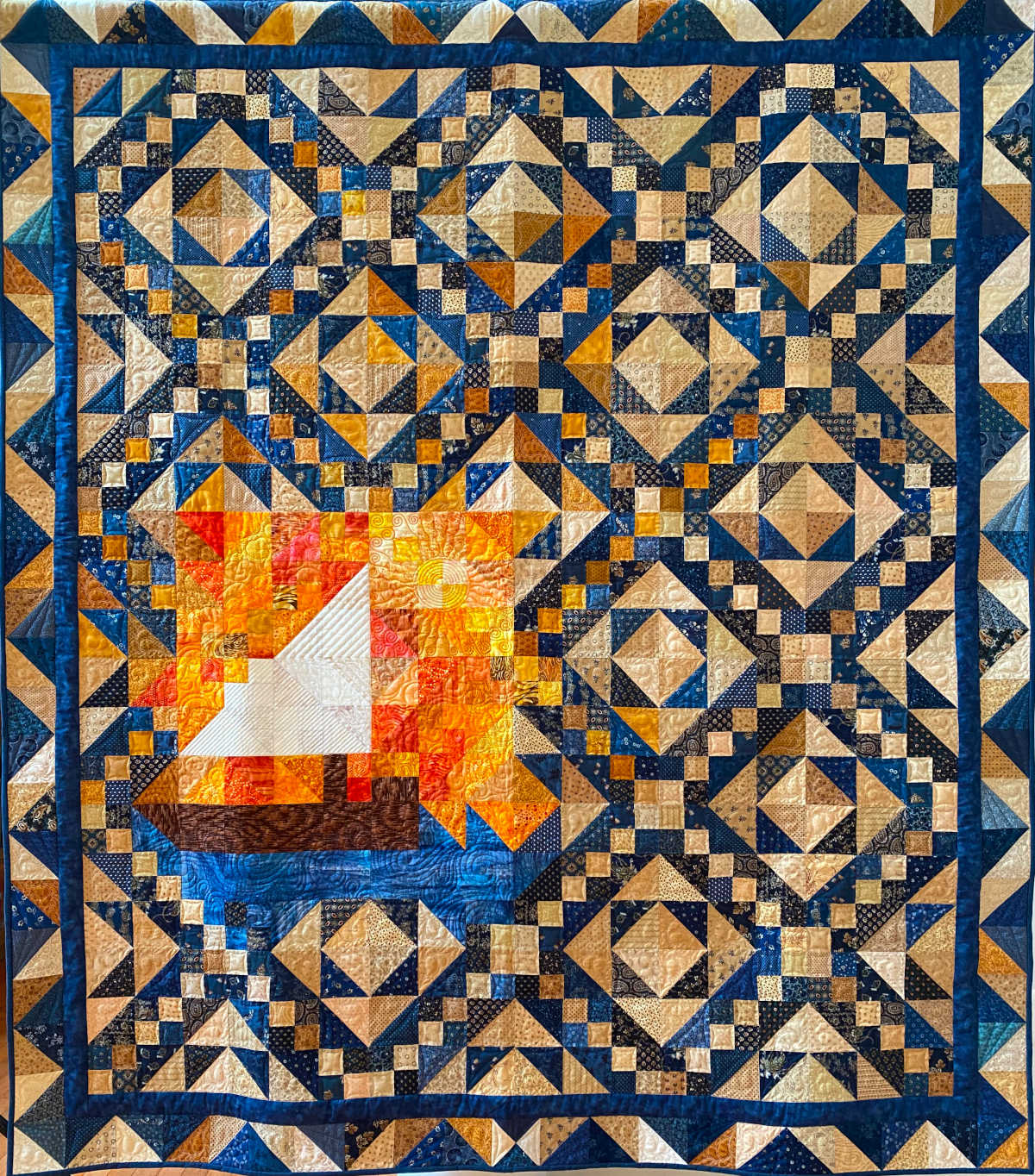 The 2022-2023 AQG raffle quilt, "Sunset Sail," was designed and made by Hilke Hoefer, Carolyn Dixson, Jane Mullenix and Joy Coffelt. Custom quilting by Joy Coffelt.